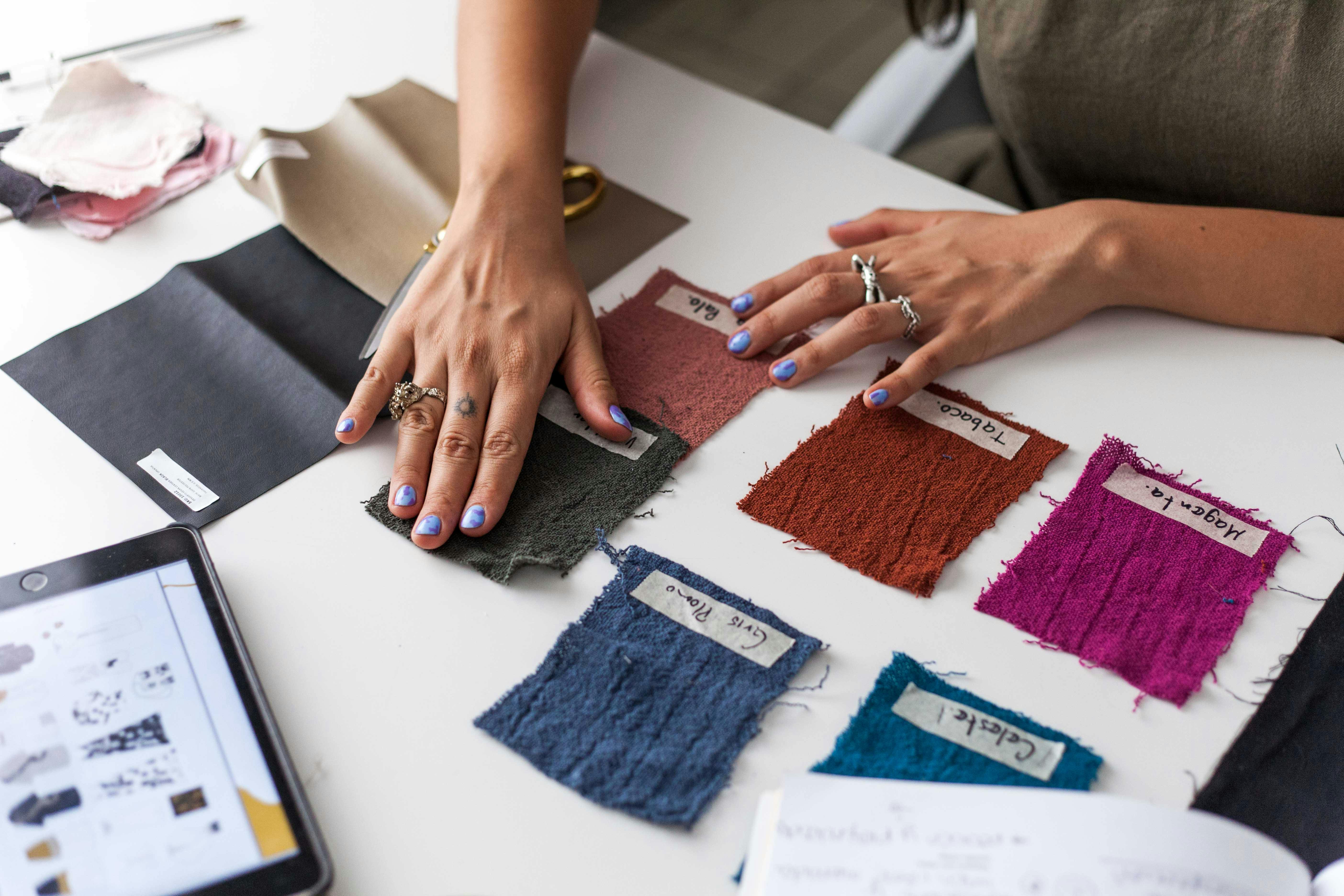 Lu performing a color analysis session with Pantone drapes in Miami